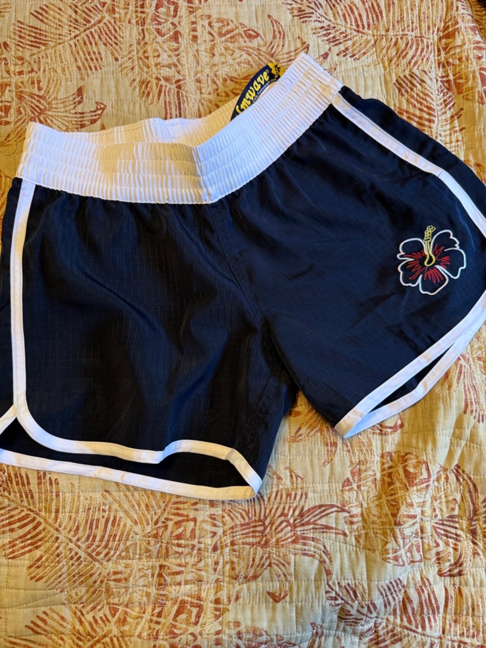 Women's Black Athletic Shorts with White Waistband and Hibiscus Accent